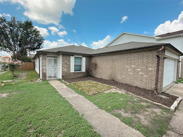 13426 Sanderford Ln, Houston, TX 77083 - view of side of home with an attached garage, brick siding, and concrete driveway