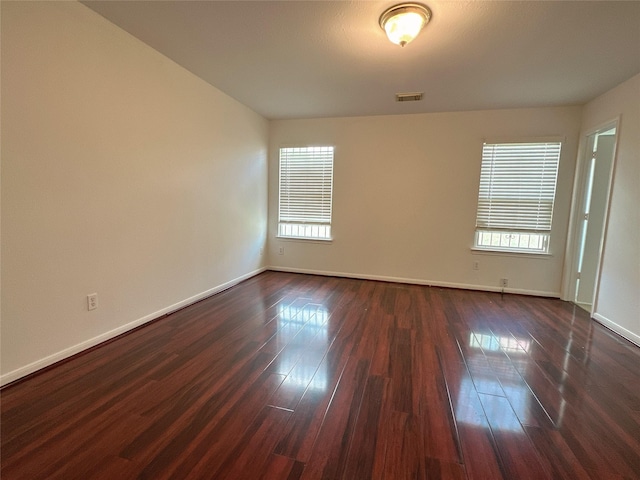 13426 Sanderford Ln, Houston, TX 77083 - empty room featuring healthy amount of natural light and dark wood finished floors
