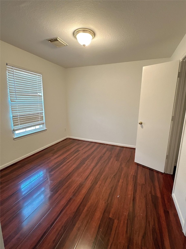 13426 Sanderford Ln, Houston, TX 77083 - empty room featuring wood finished floors and a textured ceiling