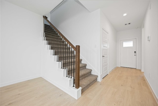 31638 Farlam Farms Trl, Fulshear, TX 77441 - foyer featuring light wood-type flooring, stairs, and recessed lighting