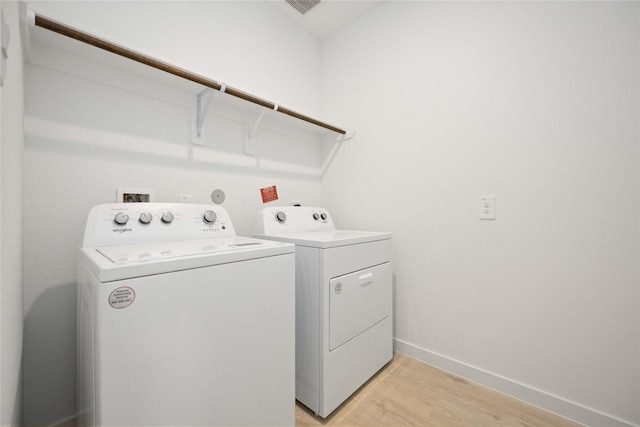 31638 Farlam Farms Trl, Fulshear, TX 77441 - washroom with separate washer and dryer and light wood-type flooring