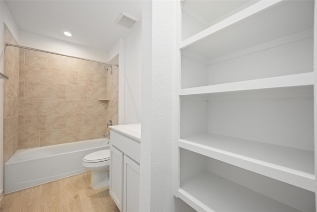 31638 Farlam Farms Trl, Fulshear, TX 77441 - bathroom featuring wood finished floors, shower / bathtub combination, vanity, and recessed lighting