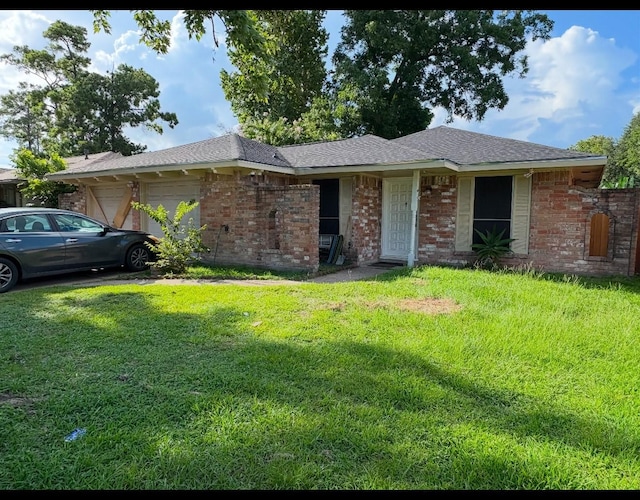 7722 Breezeway St, Houston, TX 77040 - single story home featuring a garage, brick siding, and a front lawn