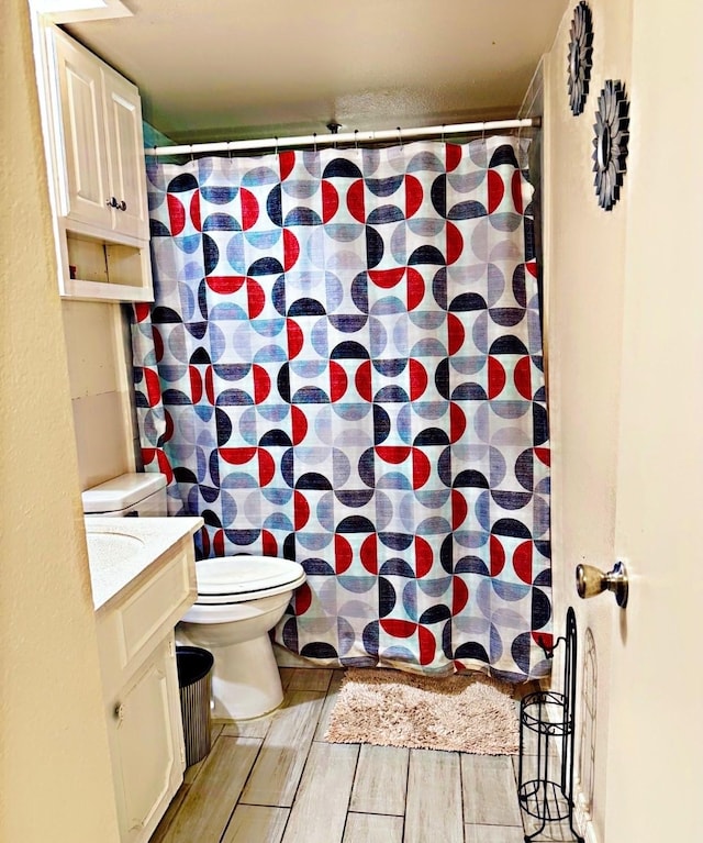 7722 Breezeway St, Houston, TX 77040 - full bathroom with vanity, wood finished floors, and curtained shower