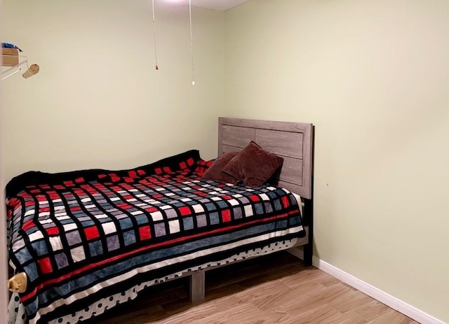 7722 Breezeway St, Houston, TX 77040 - bedroom featuring wood finished floors and baseboards