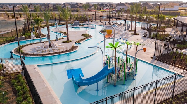 21230 Blue Bluff Dr, Cypress, TX 77433 - community pool with a water slide, a residential view, and a water play area