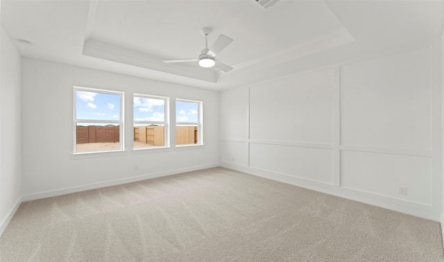 21230 Blue Bluff Dr, Cypress, TX 77433 - unfurnished room with a raised ceiling, light colored carpet, and ceiling fan