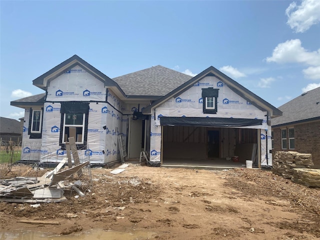 21230 Blue Bluff Dr, Cypress, TX 77433 - unfinished property featuring an attached garage, a shingled roof, and driveway