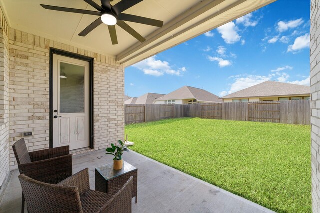 187 Solana Point Dr, Katy, TX 77493 - fenced backyard with a ceiling fan and a patio area