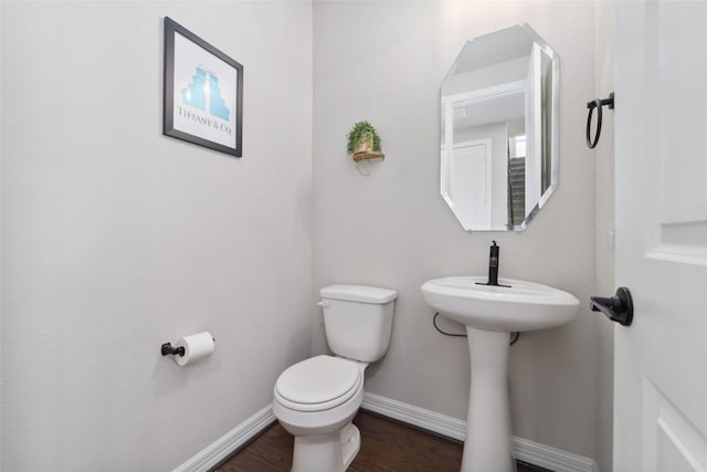 187 Solana Point Dr, Katy, TX 77493 - half bathroom with toilet and wood finished floors
