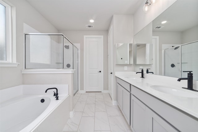187 Solana Point Dr, Katy, TX 77493 - bathroom with double vanity, a shower stall, a bath, marble finish floors, and recessed lighting
