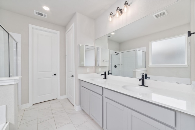 187 Solana Point Dr, Katy, TX 77493 - bathroom with a stall shower, double vanity, and marble finish floors