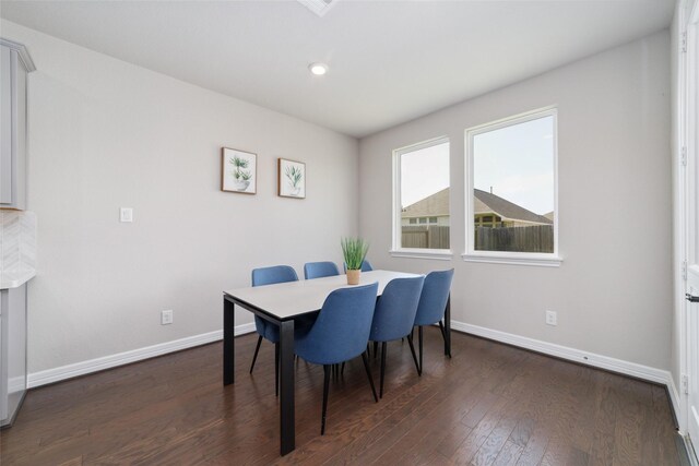 187 Solana Point Dr, Katy, TX 77493 - dining area with baseboards and dark wood-type flooring