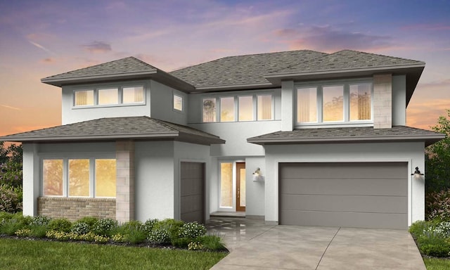 21726 Emerton Crescent Way, Cypress, TX 77433 - prairie-style house featuring a garage, stucco siding, concrete driveway, and stone siding