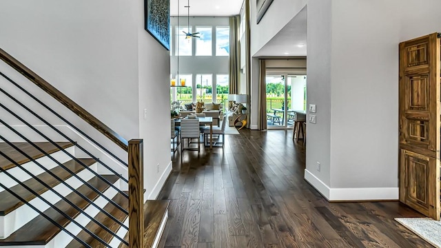 21726 Emerton Crescent Way, Cypress, TX 77433 - foyer with a towering ceiling, a ceiling fan, dark wood-style flooring, and stairway