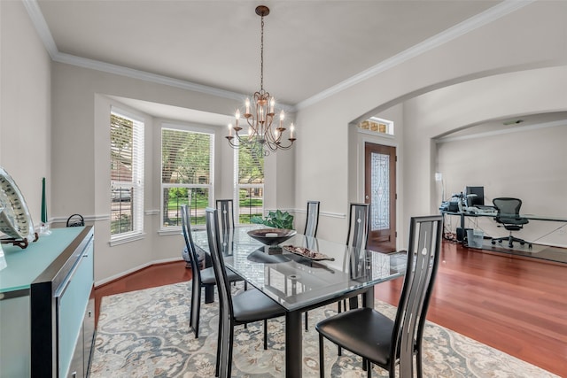 13811 Brannon Field Ln, Houston, TX 77041 - dining area featuring wood finished floors, arched walkways, crown molding, a chandelier, and an office area