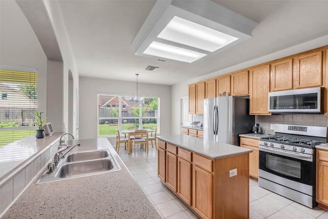 13811 Brannon Field Ln, Houston, TX 77041 - kitchen with appliances with stainless steel finishes, arched walkways, tasteful backsplash, light countertops, and a chandelier