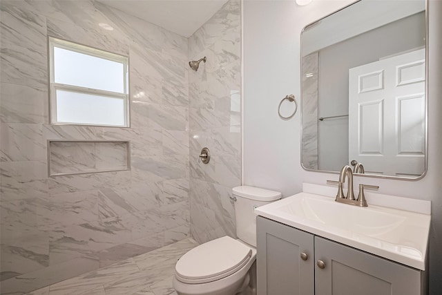 52 Penway St, Houston, TX 77022 - full bathroom with vanity, a tile shower, and marble look tile flooring