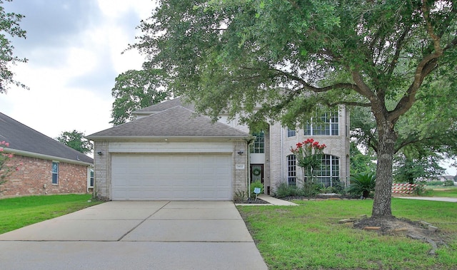 3402 Pine Run Dr, Spring, TX 77388 - view of front of house featuring driveway, brick siding, an attached garage, and a front yard