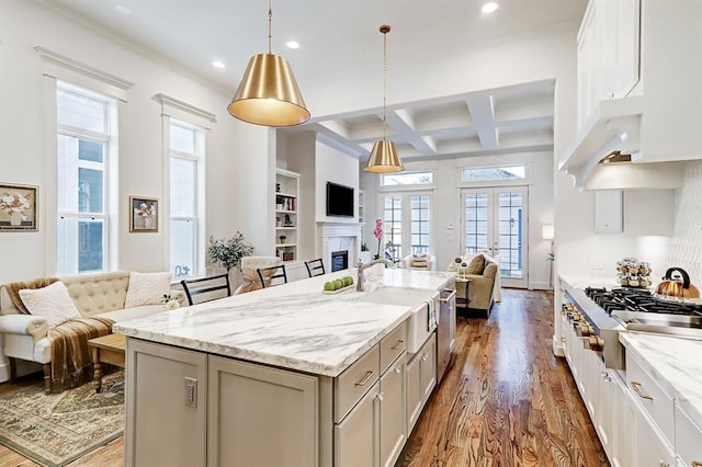 325 W 23rd St, Houston, TX 77008 - kitchen with open floor plan, dark wood-type flooring, gray cabinetry, recessed lighting, and appliances with stainless steel finishes