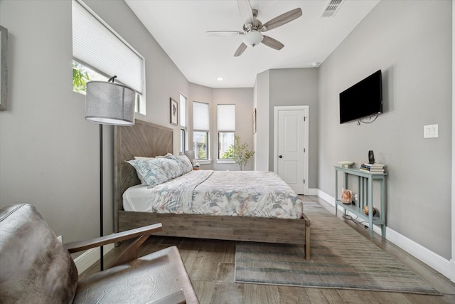 1219 W 25th St Unit A, Houston, TX 77008 - bedroom with multiple windows, wood finished floors, recessed lighting, and a ceiling fan