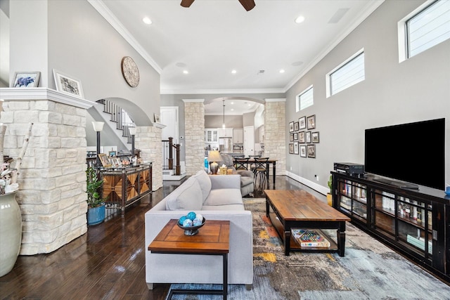 1219 W 25th St Unit A, Houston, TX 77008 - living area featuring arched walkways, ornate columns, ceiling fan, stairs, and ornamental molding