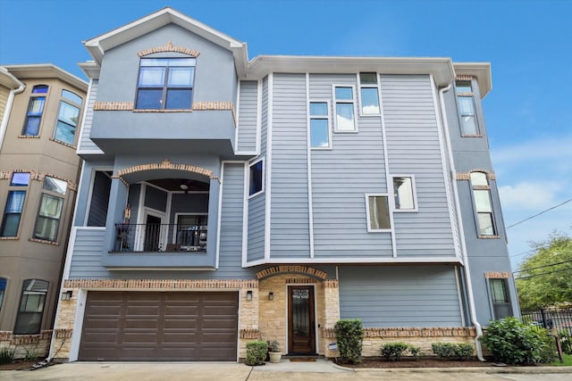1219 W 25th St Unit A, Houston, TX 77008 - townhome / multi-family property with a balcony, an attached garage, and concrete driveway