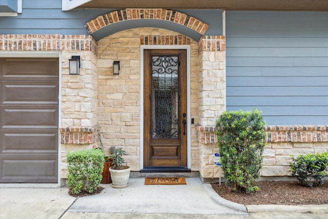 1219 W 25th St Unit A, Houston, TX 77008 - entrance to property featuring stone siding and a garage