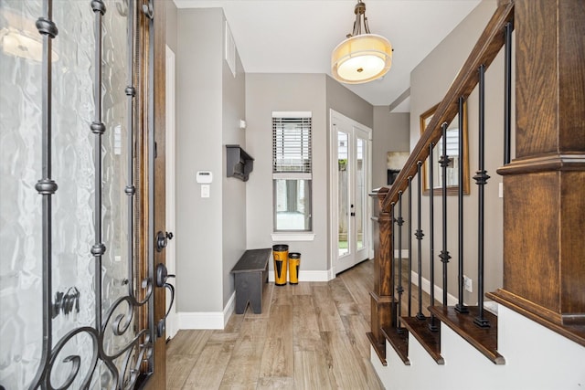 1219 W 25th St Unit A, Houston, TX 77008 - foyer entrance with light wood-type flooring and stairs