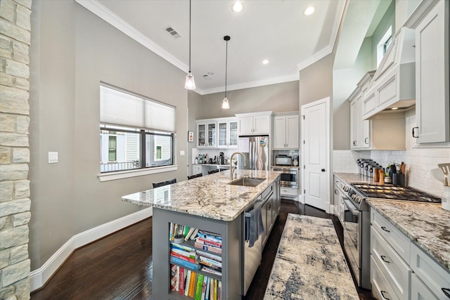 1219 W 25th St Unit A, Houston, TX 77008 - kitchen with stainless steel appliances, custom range hood, tasteful backsplash, dark wood-style floors, and ornamental molding