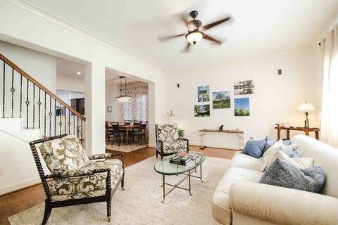 1616 Southmore Blvd, Houston, TX 77004 - living room featuring a ceiling fan, stairway, and wood finished floors