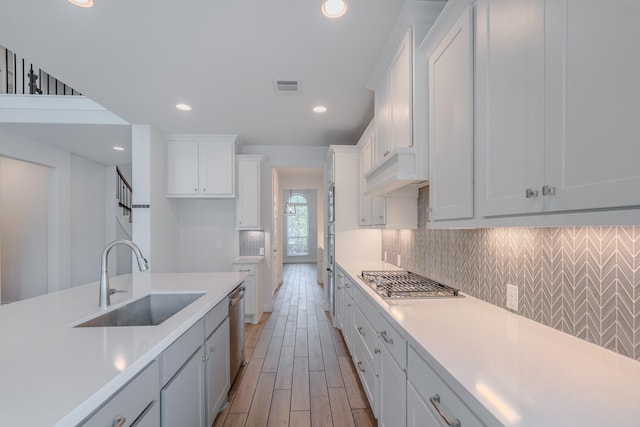 17010 Harpers Way, Conroe, TX 77385 - kitchen featuring stainless steel appliances, light countertops, tasteful backsplash, and recessed lighting