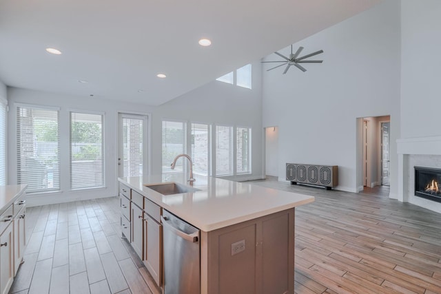 17010 Harpers Way, Conroe, TX 77385 - kitchen featuring dishwasher, open floor plan, light countertops, light wood-style floors, and recessed lighting