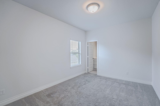 17010 Harpers Way, Conroe, TX 77385 - carpeted spare room featuring baseboards