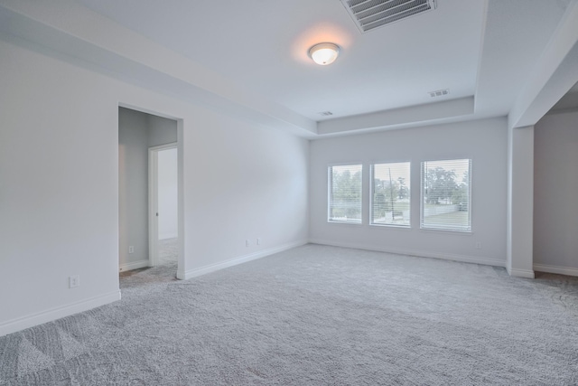 17010 Harpers Way, Conroe, TX 77385 - carpeted spare room featuring baseboards and a tray ceiling