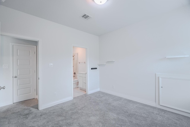17010 Harpers Way, Conroe, TX 77385 - unfurnished bedroom featuring carpet floors and connected bathroom