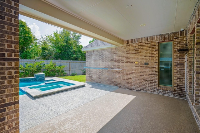 17010 Harpers Way, Conroe, TX 77385 - view of patio / terrace with an in-ground hot tub