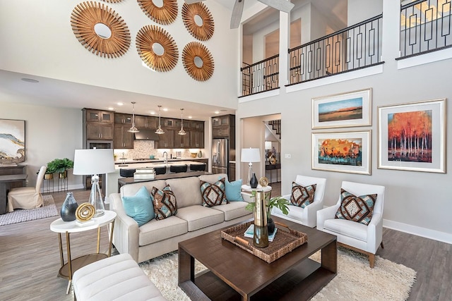9218 Heckenberg Arbor Ln, Cypress, TX 77433 - living room featuring light wood finished floors and a high ceiling