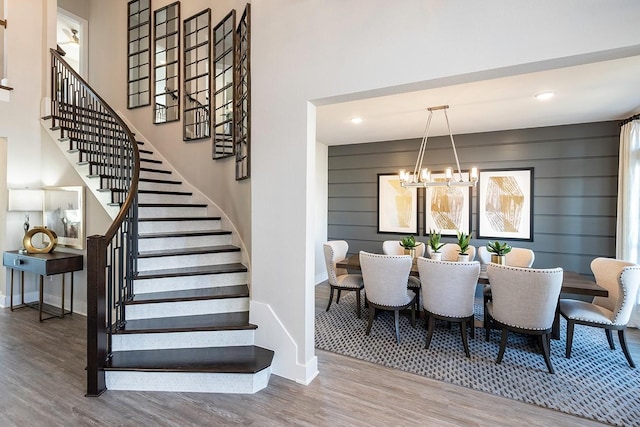 9218 Heckenberg Arbor Ln, Cypress, TX 77433 - stairway with a chandelier, wood finished floors, and recessed lighting