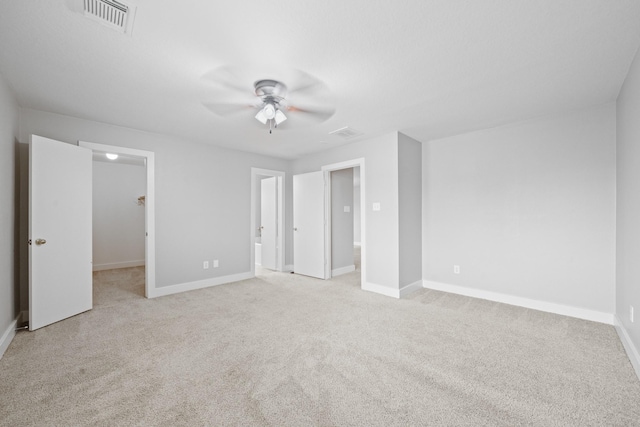 20931 Walder Ct, Katy, TX 77449 - unfurnished bedroom with light carpet, a spacious closet, a ceiling fan, and connected bathroom