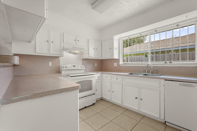 4718 Misty Shadows Dr, Houston, TX 77041 - kitchen with white appliances, under cabinet range hood, white cabinetry, tasteful backsplash, and a textured ceiling
