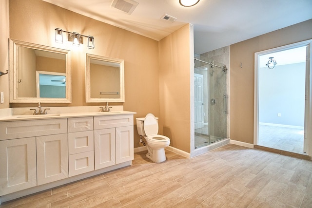 12234 Dumas St, Houston, TX 77034 - bathroom with a shower stall, double vanity, and wood finished floors