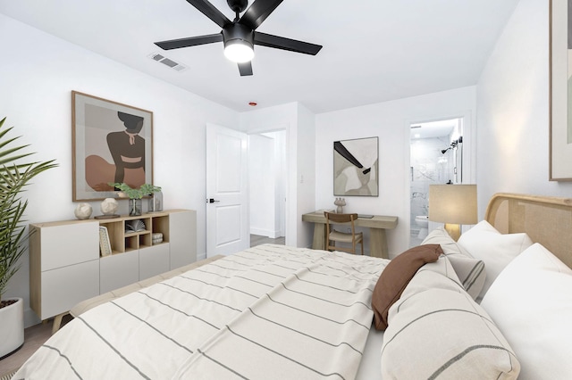 6615 Dewville Ln, Houston, TX 77076 - bedroom featuring ceiling fan, wood finished floors, and ensuite bath