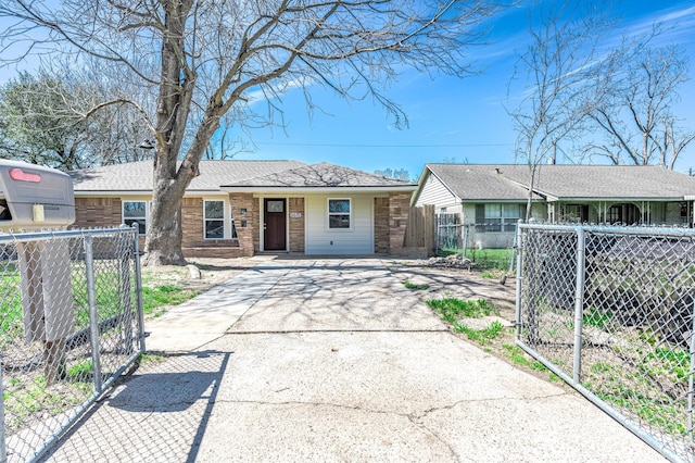 6615 Dewville Ln, Houston, TX 77076 - ranch-style house featuring a gate, brick siding, and driveway