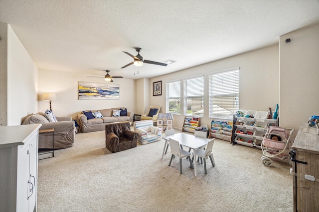 18314 Harvest Star Ct, Houston, TX 77084 - living room with light carpet, a ceiling fan, and a textured ceiling