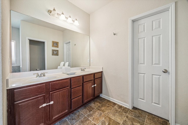 18314 Harvest Star Ct, Houston, TX 77084 - bathroom featuring double vanity and baseboards
