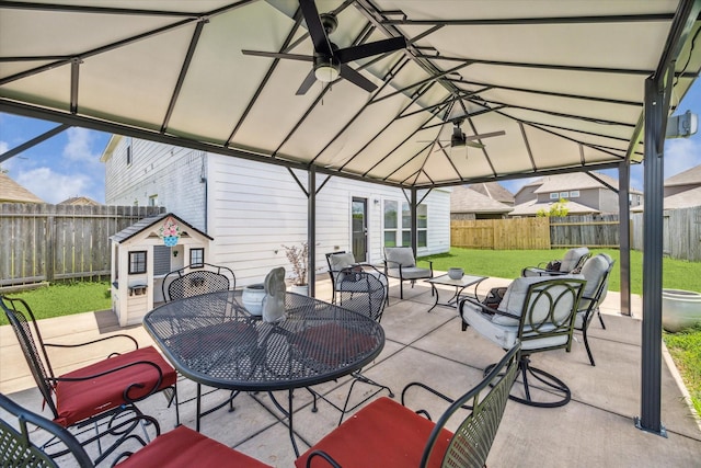 18314 Harvest Star Ct, Houston, TX 77084 - fenced backyard with a patio area, a ceiling fan, and outdoor dining area