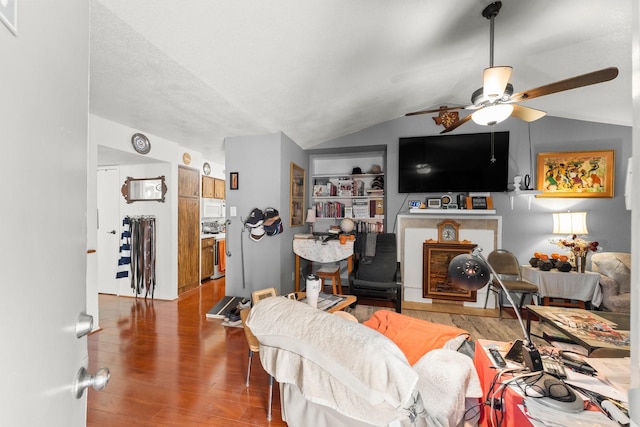 6701 Sands Point Dr Unit 114, Houston, TX 77074 - living area featuring vaulted ceiling, wood finished floors, a ceiling fan, and built in shelves