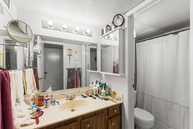 6701 Sands Point Dr Unit 114, Houston, TX 77074 - bathroom featuring vanity, a textured ceiling, and a shower with curtain