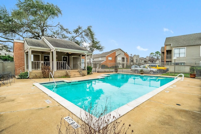 6701 Sands Point Dr Unit 114, Houston, TX 77074 - community pool featuring a patio area, ceiling fan, and a residential view